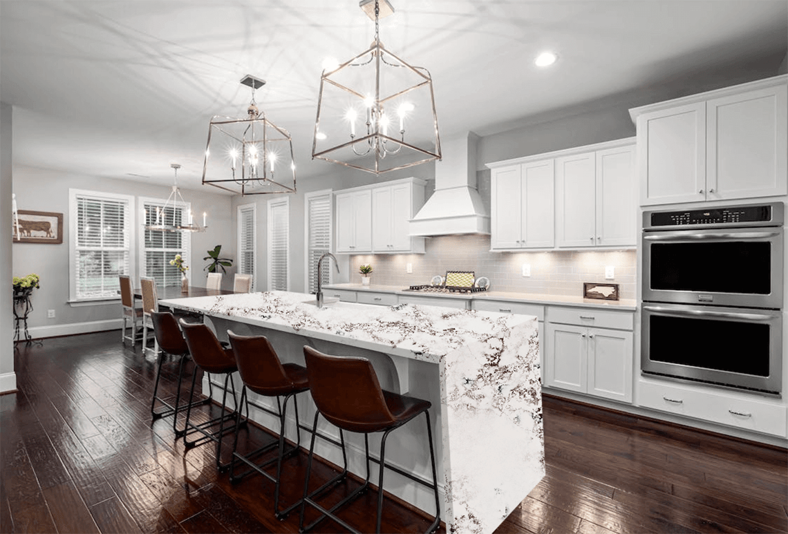 Kitchen — marble waterfall island with reinforced miter joints